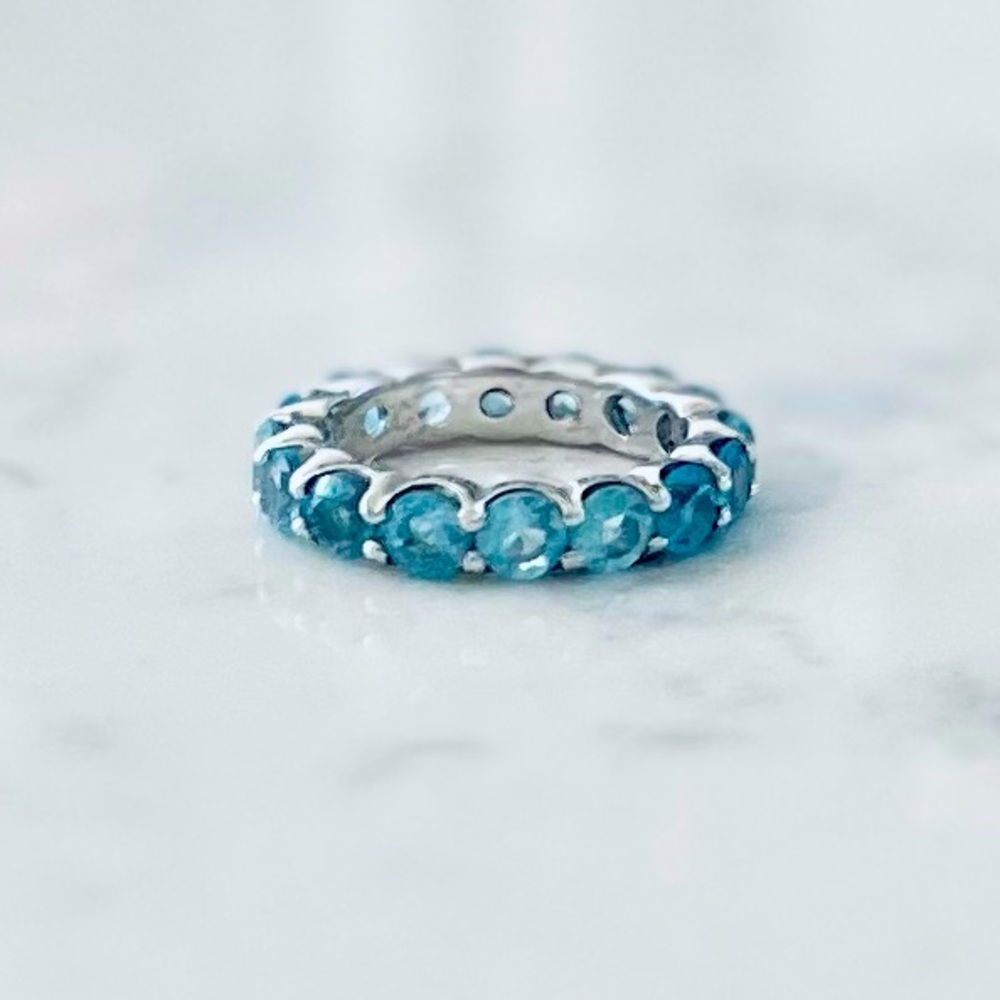 Wms anniversary ring blue topaz sterling silver size 7, excellent pre-owned cond